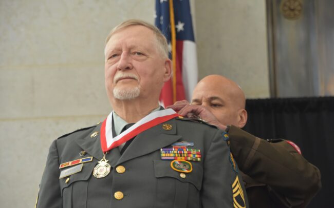 Donald E. Austin receiving his medal