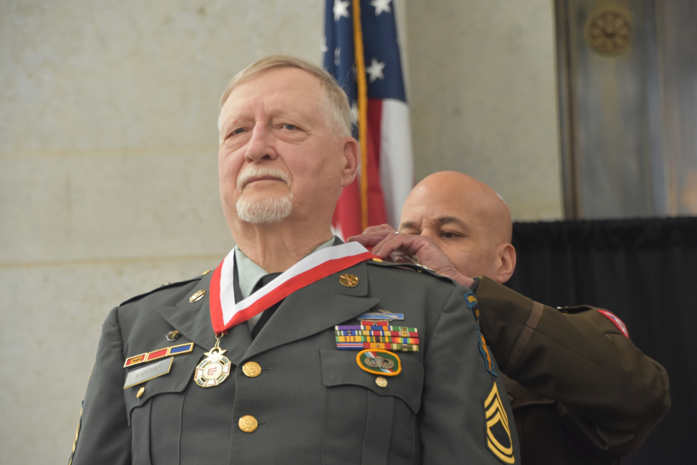 Donald E. Austin receiving his medal