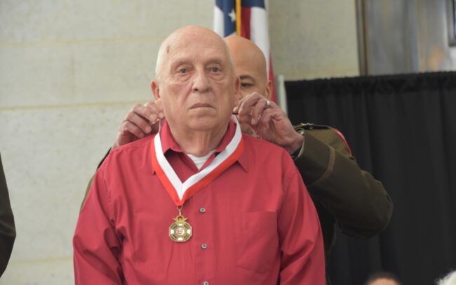 Donald L. Justice receiving his medal